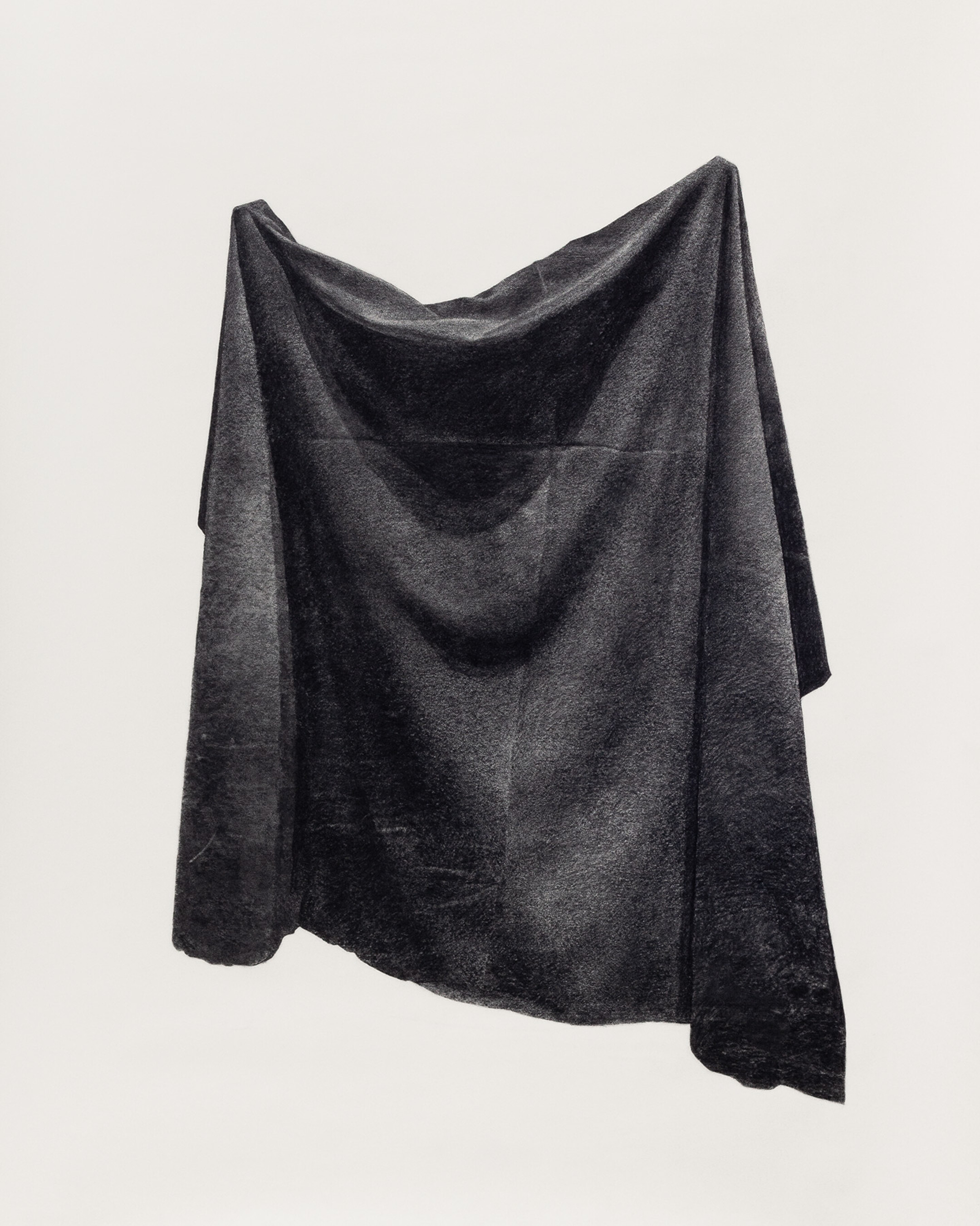 Drawing of draped fabric in charcoal on paper